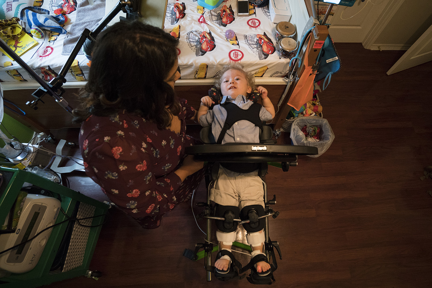 Kristen Resendez of Harlingen places her son, Jack, in a pediatric standing frame in their home in Harlingen, Texas. Jack has spinal muscular atrophy, costing him the ability to use most of his body.