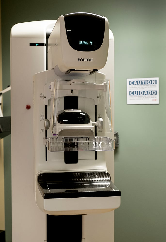 During a 3-D mammogram, the machine arcs over the breast.