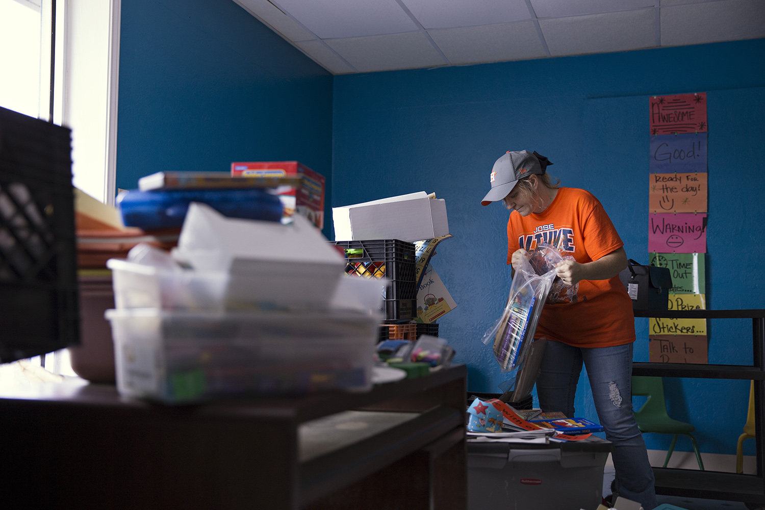 Anna Lingo sorts through salvaged items from the James Hope Center after it was flooded during Hurricane Harvey. 
