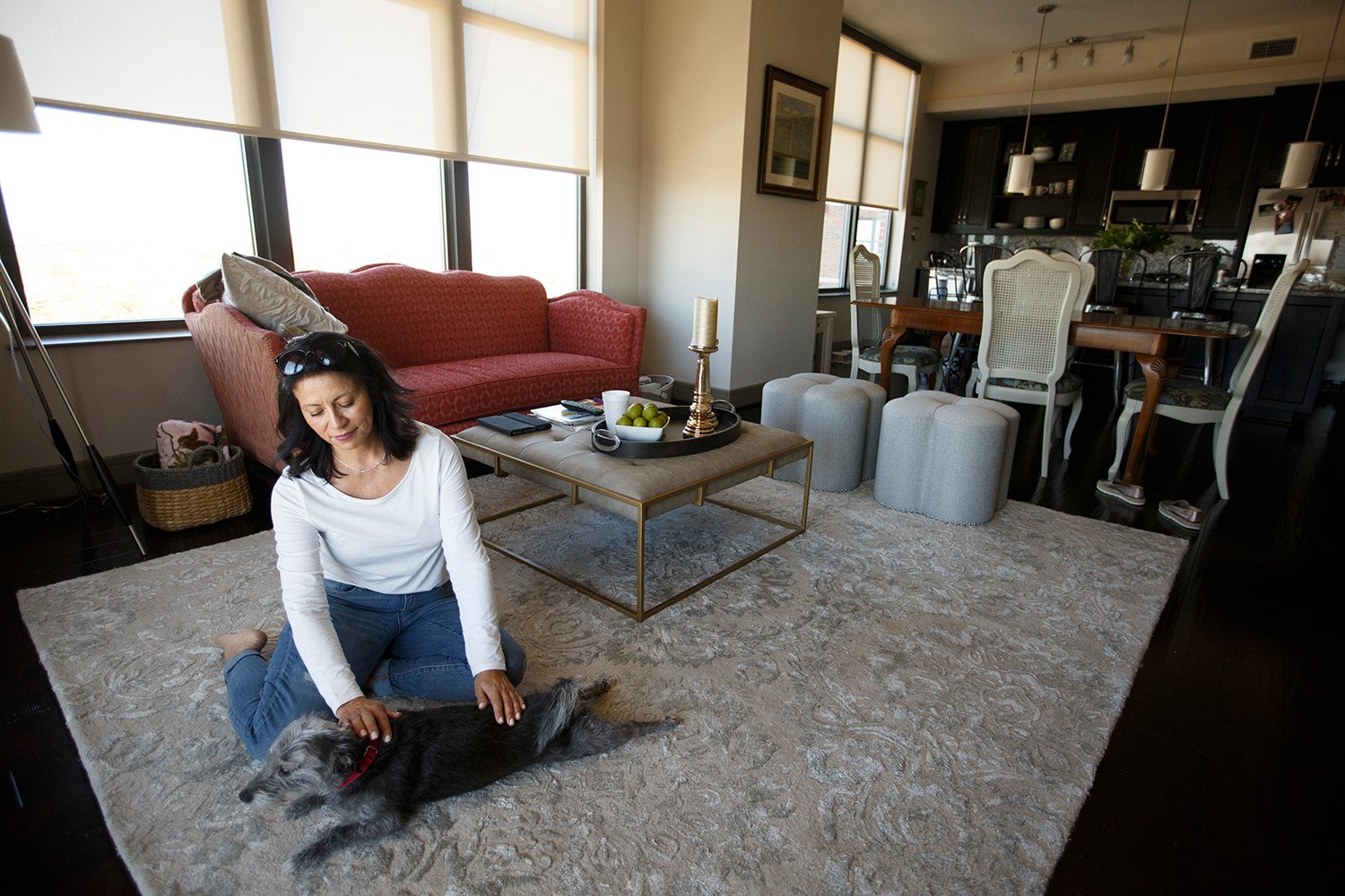 Maria Keene in the high rise apartment she and her husband and two daughters have rented in Houston on Oct. 26, 2017.