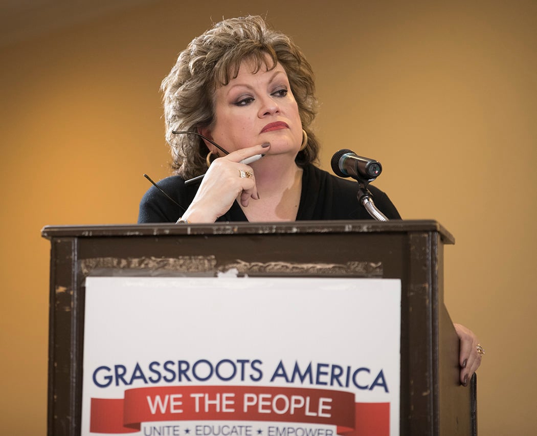 JoAnn Fleming, executive director of Grassroots America We The People, moderates a Republican primary debate between incumbent Agriculture Commissioner Sid Miller and challenger Trey Blocker.