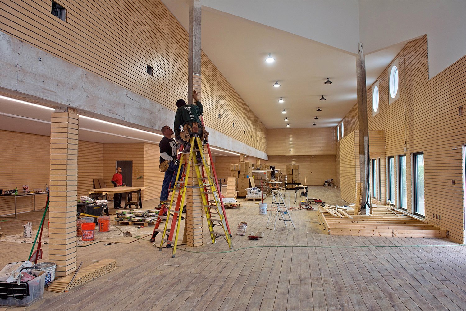 Workers prepare the interior of Third Coast Beach Co. in February 2018. The store was flooded with 31 inches of water when Hurricane Harvey hit. The owner is expecting to be open in 2 weeks.