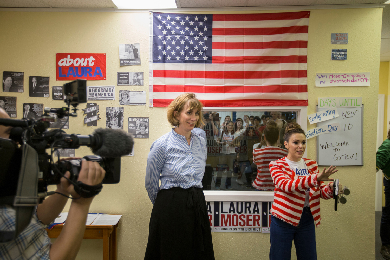 Laura Moser, one of seven Democrats competing for a Houston Congressional seat, and actress and activist Alyssa Milano speak to campaign volunteers on Saturday. In an unusual move, Moser was called out by her own party when the Democratic Congressional Campaign Committee called her too liberal for the district. 