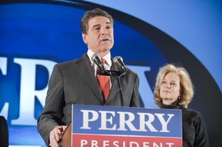 Gov. Rick Perry and his wife, Anita, addressing supporters after his fifth-place finish in the Iowa caucuses on Jan. 3, 2012.