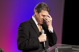 Gov. Rick Perry praying at The Response, a two-hour evangelical gathering in Greenville, S.C., on Jan. 17, 2012, resembling the massive prayer event of the same name Perry hosted in August 2011.