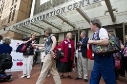 Texas Republican Convention delegates congregate outside the Fort Worth Convention Center on June 7, 2012.