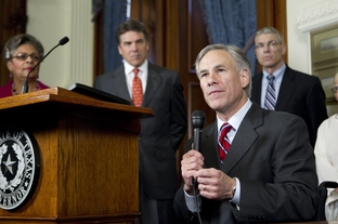 Attorney General Greg Abbott, Gov. Rick Perry, state Rep. Senfronia Thompson and Department of Public Safety chief Steve McCraw at the signing of House Bill 3000 on May 25, 2011.