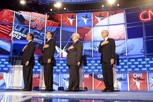 Republican candidates, left to right, Rick Santorum, Mitt Romney, Newt Gingrich and Ron Paul say the Pledge of Allegiance at the CNN Charleston debates on January 19, 2012.