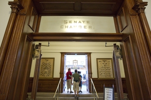 Tourists enter the empty Senate chamber Wednesday morning as the Texas Senate adjourned sine die the day before, leaving the House with unfinished business on June 29, 2011.