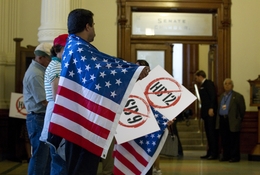 Protesters with American flags line the hallway outside the Senate chamber protesting HB12 the so-called "sanctuary cities" bill on May 25, 2011.