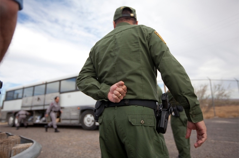 Border Patrol officers outside a bus in Presidio.
