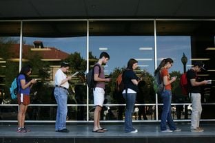 Voters wait in line to cast their ballots at the Flawn Academic Center on the University of Texas at Austin campus on Nov. 6, 2012.