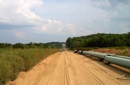 Pipe sections in Illinois await crews to weld and bury them during construction in 2009. This segment of the $12 billion Keystone pipeline project has already been built; a proposed pipeline through Texas still awaits government permits.